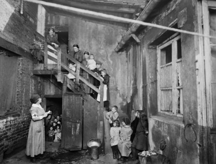American Red Cross Nurse visiting Refugees in Housing Condemned before the War
