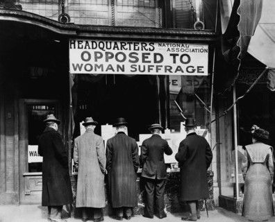 Men looking at Material posted in Window of National Association Opposed to Woman Suffrage Headquarters