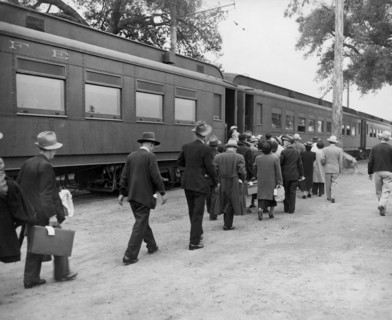 Evacuees boarding Special Train at Assembly Center enroute to a War Relocation Center