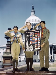 Portrait of Three Saluting Boy Scouts helping to Distribute The United Nations Fight for Freedom Posters to help War Effort