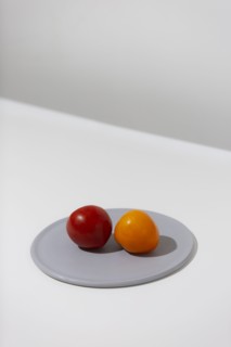 Red and Orange Tomatoes on Grey Plate