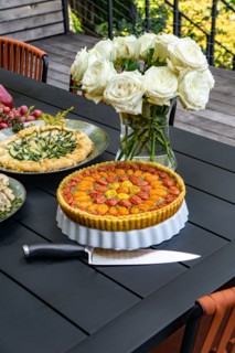 Tomato and Zucchini Tarts on Table in Outdoor Setting