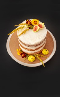 High Angle View of Vanilla Layer Cake Decorated with Edible Fresh Flowers and Fruit
