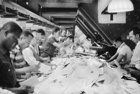 Workers sorting mail at Post Office, New York City, May 1957