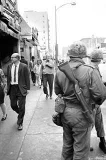 Members of National Guard patrolling streets as pedestrians walk by after riots following Dr. Martin Luther King Jr's, Assassination, April 8