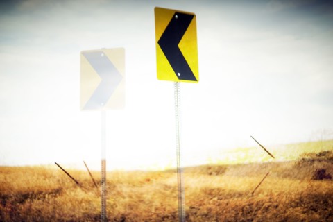 Directional Road Signs in Rural Landscape,,