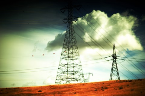 Transmission Towers and Cloudy Sky in Rural Landscape ,,