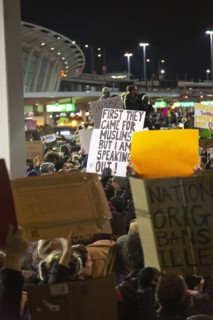 Crowd holding Signs at Protest against Muslim Travel Ban, JFK Airport,