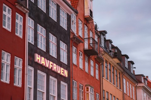 Havfruen Neon Sign on building at Sunset, Copenhagen,