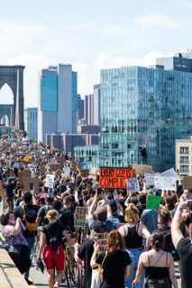 Crowd of Protesters with Signs Marching across Brooklyn Bridge during Juneteenth March, New York City,