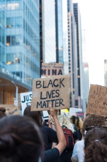 Protester holding up Black Lives Matter Sign during Juneteenth March, Midtown,