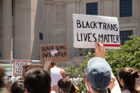 Protesters holding up Black Trans Lives Matter Signs during Protest outside Brooklyn Museum, Brooklyn,