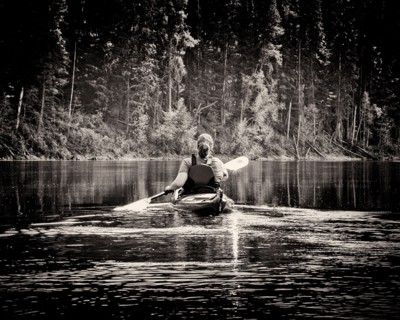 Rear View of Woman Kayaking,,