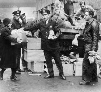 Police distributing Eggs and Bread to City's Needy at East 104th St. Station House, New York City