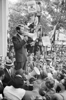 U.S. Attorney General Robert Kennedy speaking to a crowd of African Americans and whites through a Megaphone outside Justice Department Washington, D.C.