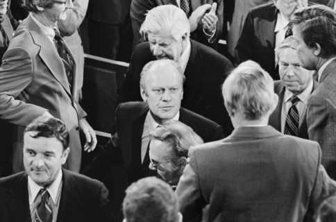 U.S. President Gerald Ford surrounded by members of the 94th Congress, including Majority Leader Tip O'Neill