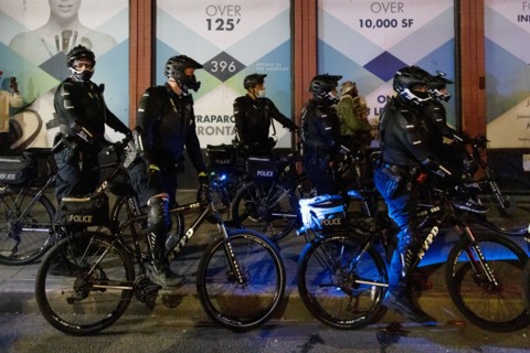 Heavily Geared NYPD Officers on Bicycles at Night, before Election