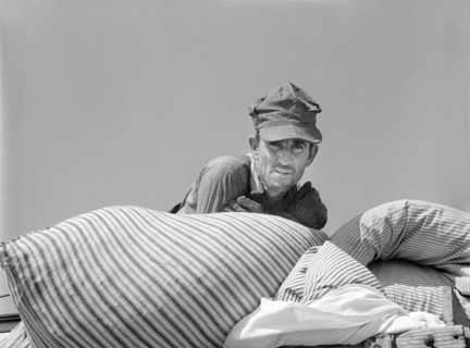 Head and Shoulders Portrait of Truck Owner who moved Family into new Prefabricated House