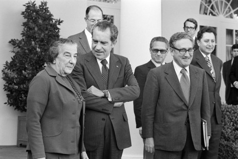 Israeli Prime Minister Golda Meir standing with U.S. President Richard Nixon and U.S. Secretary of State Henry Kissinger