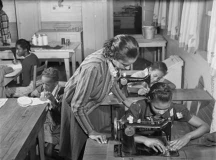 Students learning to Sew on Sewing Machines