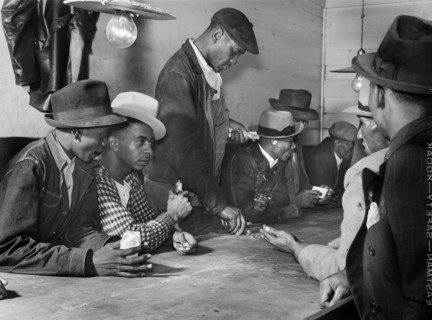 Men spending their money in Gambling and Juke Joint