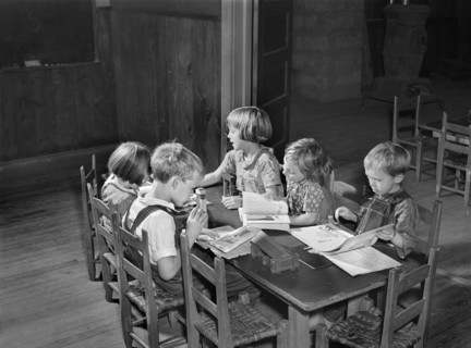 Young Students studying at Table in Rural Classroom