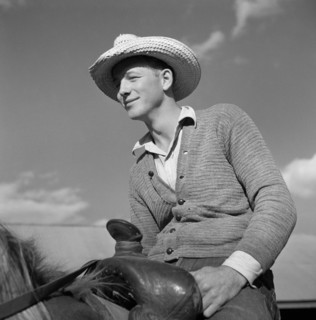 Cowboy on Ranch Horse in Corral at Quarter Circle U