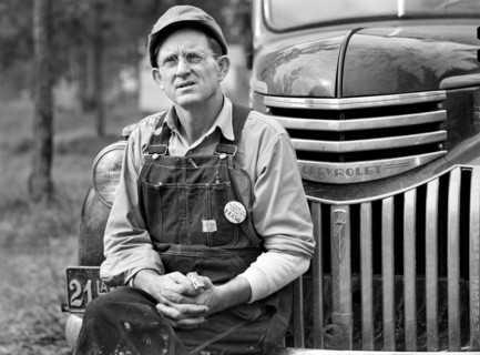 Construction Worker sitting on Car before leaving for Evening Shift