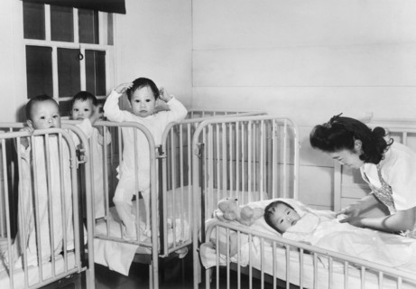 Nurse tending to Orphan Infants in Nursery