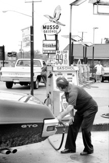Man pumping Gasohol at Gas Station