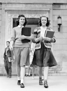 Two Students coming out of Library at Iowa State College