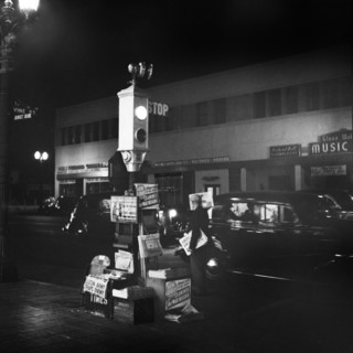 Newsstand and Traffic Light at Night