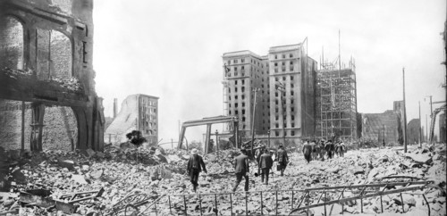 People walking through Rubble 2 days after Earthquake