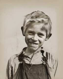 Son of cotton picker living in squatters' camp near Farmersville
