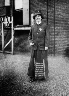 Suffragist posing in Police Uniform to illustrate Woman Police Concept