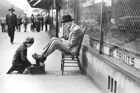 Young Boy shining Shoes