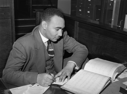 Employee in Real Estate Office catering to Black Clients