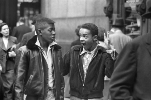 Two Teen Boys walking along Street