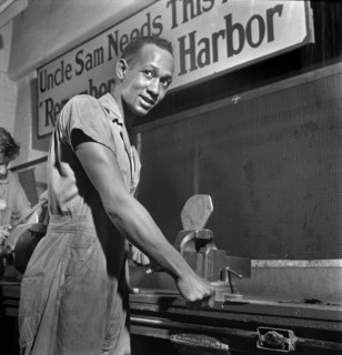 Young Adult Man receiving training in machine shop practice