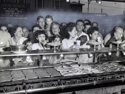 Group of People lined up at Counter