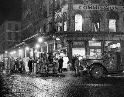 Trucks being loaded with Produce at Night