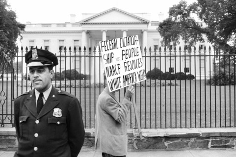 Man protesting for  John Kasper