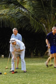 Men playing Croquet