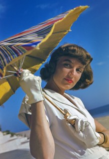 Young Woman in White Dress with Sun Umbrella