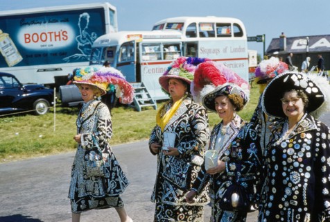 Four Women wearing Jackets and Skirts with Different Sized Buttons sewn onto them attending English Derby