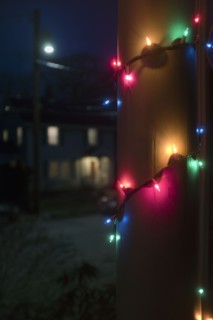 Christmas Lights wrapped around Porch Column at Night