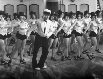Jackie Oakie with Rows of Chorus Girls