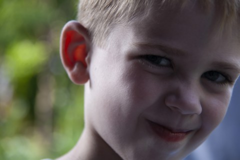 Close-up portrait of young boy smiling