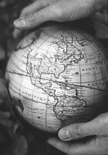 Two hands holding vintage globe of earth