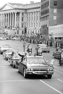 Astronaut Gordon Cooper in a car with U.S. Vice President Lyndon Baines Johnson during parade